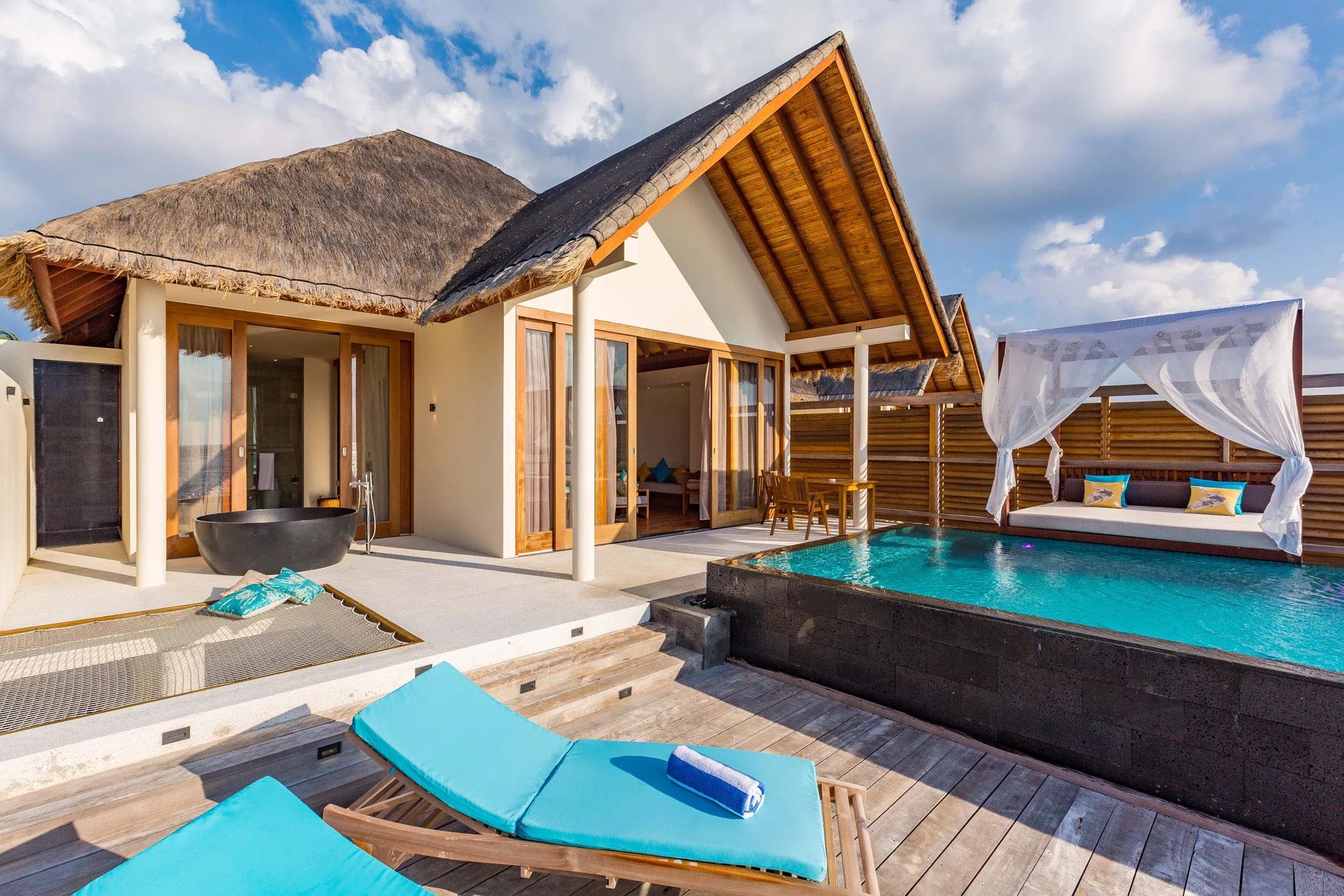 Private deck and pool area of a villa at Furaveri