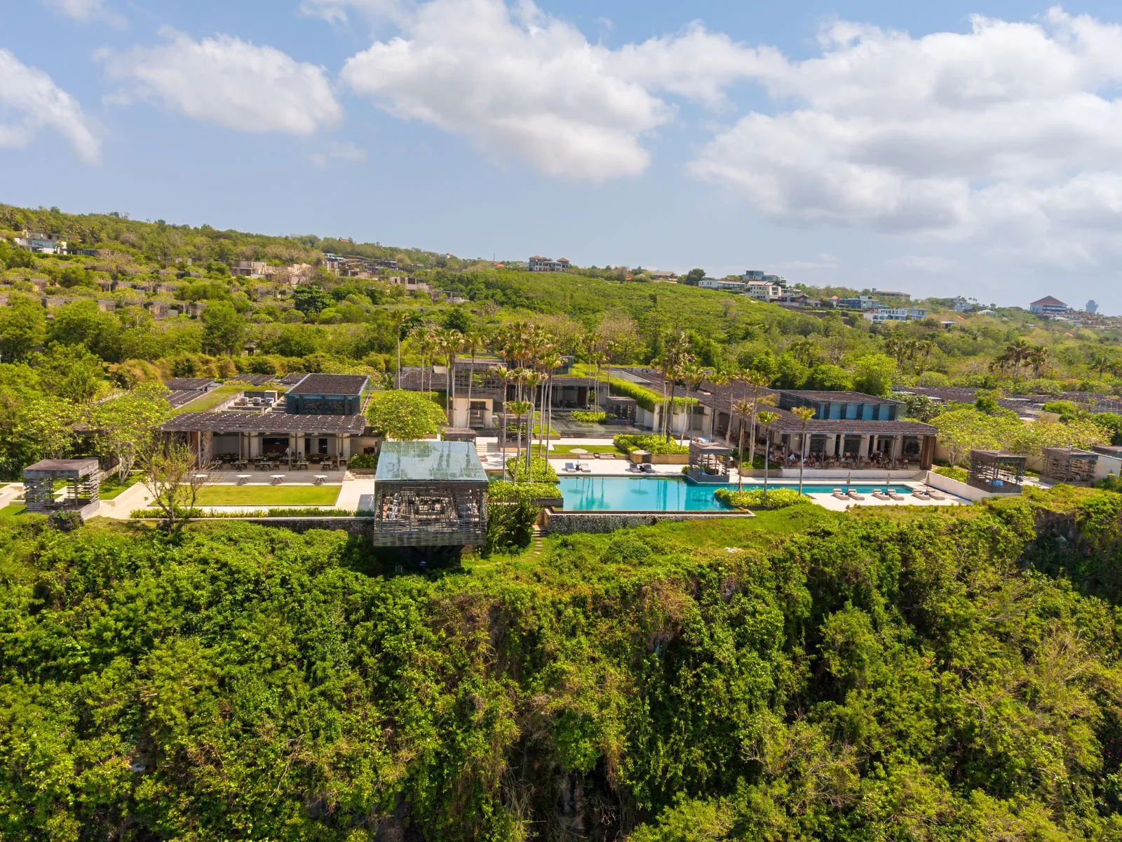 Cliffside villa overlooking the ocean at golden hour